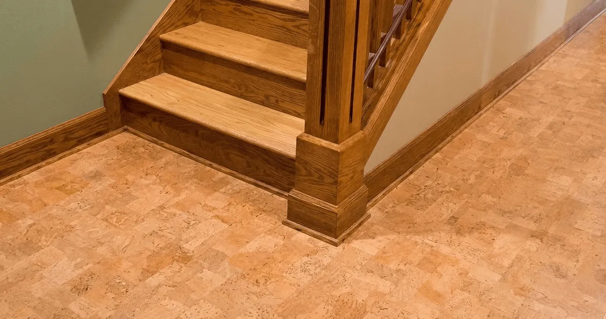 End of a staircase with cork flooring in Lakewood, CO